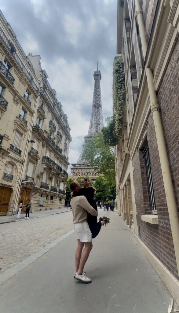 Couple in front of Eiffel Tower in Paris
