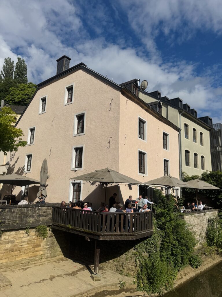 Scott's pub patio seating along Alzette river