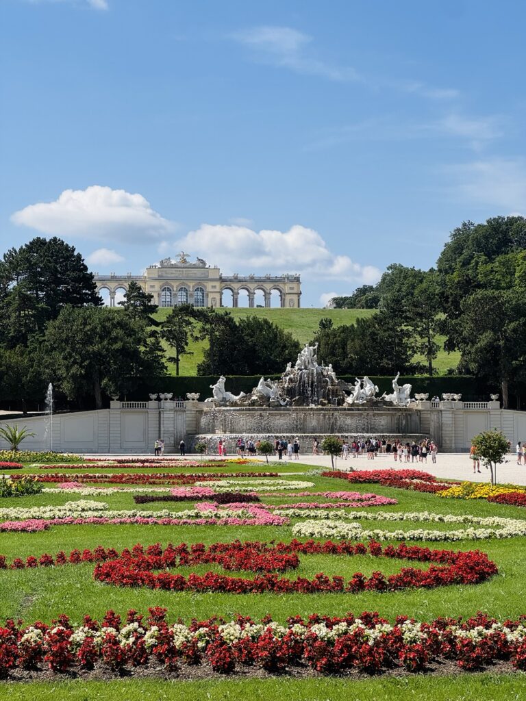 Schönbrunn Palace gardens, Neptune fountain, and Gloriette in Vienna Austria