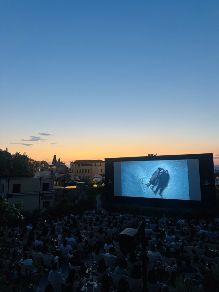 Cine Paris after sunset with movie on