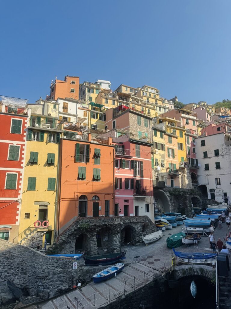 Riomaggiore with sun shining on colorful buildings