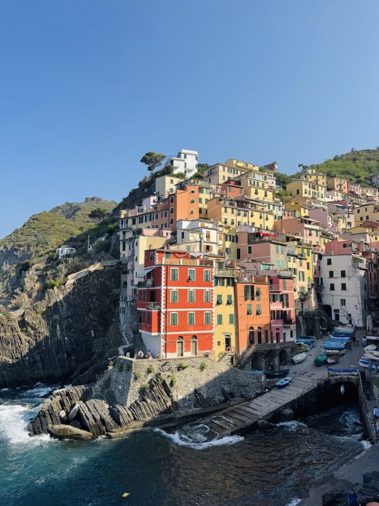 Riomaggiore with sun shining on colorful buildings